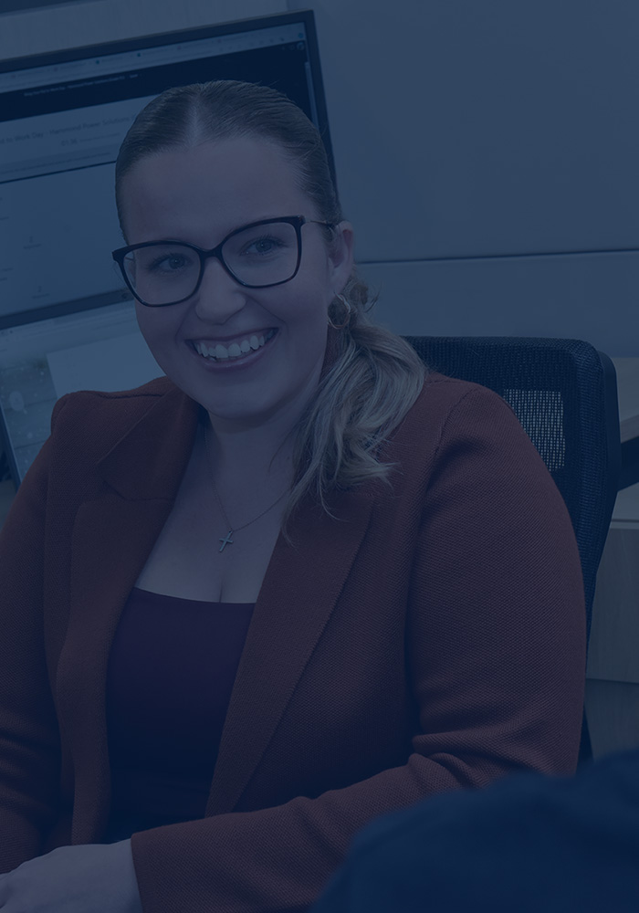 smiling woman at her desk